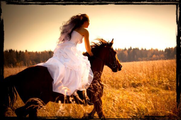 Bride galloping on horse across golden field under setting sun_Angelworks_Angel Tongue sings praise to God_Dawn Francis_Rebel-Faith