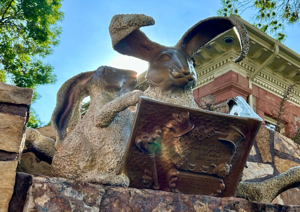 Sculpture of adult rabbit reading book to its young_It Is Written by Dawn Francis-photo by Dawn Francis_Rebel-Faith Poetry